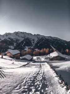 Preview wallpaper mountains, village, winter, snow, path