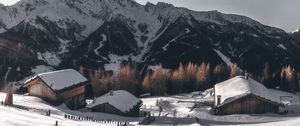 Preview wallpaper mountains, village, winter, snow, path