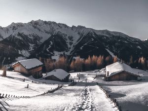 Preview wallpaper mountains, village, winter, snow, path