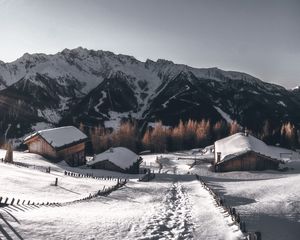 Preview wallpaper mountains, village, winter, snow, path