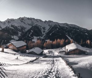 Preview wallpaper mountains, village, winter, snow, path