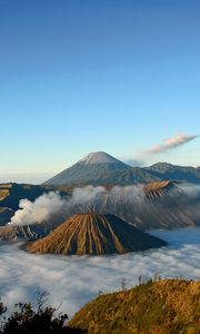 Preview wallpaper mountains, volcanoes, fog, clouds, height, craters, sky