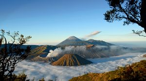 Preview wallpaper mountains, volcanoes, fog, clouds, height, craters, sky