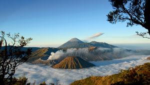 Preview wallpaper mountains, volcanoes, fog, clouds, height, craters, sky