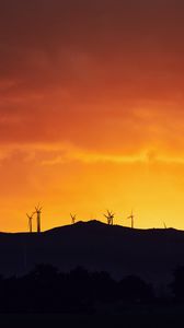 Preview wallpaper mountains, windmills, silhouette, sunset, sky