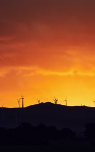 Preview wallpaper mountains, windmills, silhouette, sunset, sky