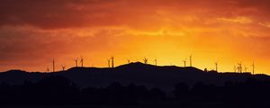 Preview wallpaper mountains, windmills, silhouette, sunset, sky