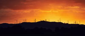 Preview wallpaper mountains, windmills, silhouette, sunset, sky