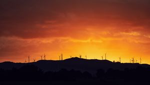 Preview wallpaper mountains, windmills, silhouette, sunset, sky