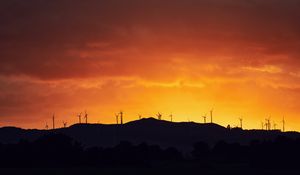 Preview wallpaper mountains, windmills, silhouette, sunset, sky