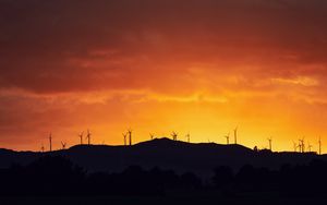 Preview wallpaper mountains, windmills, silhouette, sunset, sky