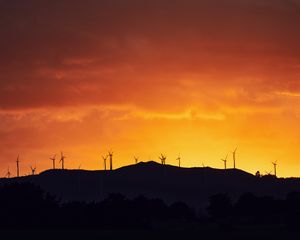 Preview wallpaper mountains, windmills, silhouette, sunset, sky