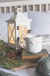 Preview wallpaper mug, books, lantern, branches, still life, aesthetics
