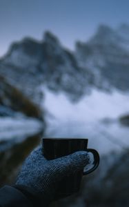 Preview wallpaper mug, hand, glove, nature, mountains