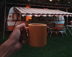 Preview wallpaper mug, hand, trailer, camping, travel