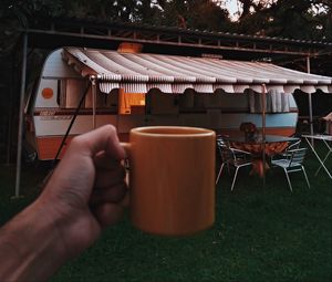 Preview wallpaper mug, hand, trailer, camping, travel