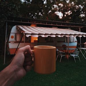 Preview wallpaper mug, hand, trailer, camping, travel