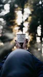 Preview wallpaper mug, hands, inscription, blur