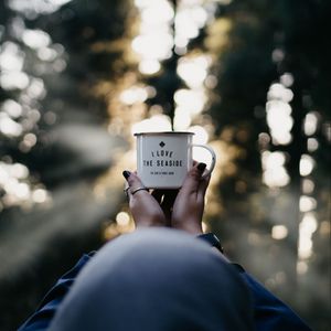 Preview wallpaper mug, hands, inscription, blur