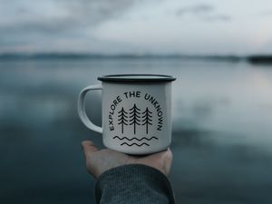 Preview wallpaper mug, inscription, hand, lake, nature