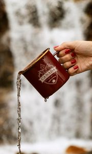 Preview wallpaper mug, jet, hand, water