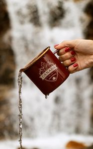 Preview wallpaper mug, jet, hand, water