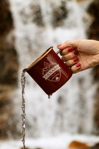 Preview wallpaper mug, jet, hand, water