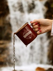 Preview wallpaper mug, jet, hand, water