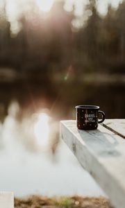 Preview wallpaper mug, pier, lake, sunlight, glare, blur