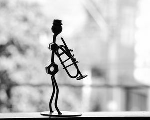 Preview wallpaper musician, pipe, metal, statue