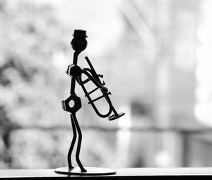Preview wallpaper musician, pipe, metal, statue