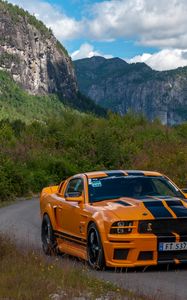 Preview wallpaper mustang shelby, car, muscle car, orange, road, mountains