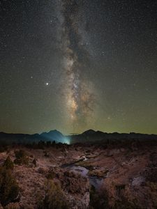 Preview wallpaper nebula, night, starry sky, stars, rocks