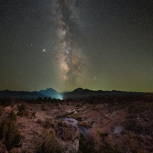 Preview wallpaper nebula, night, starry sky, stars, rocks