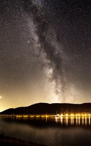 Preview wallpaper nebula, starry sky, stars, pier, lights, night