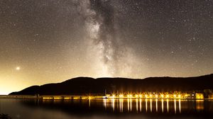 Preview wallpaper nebula, starry sky, stars, pier, lights, night
