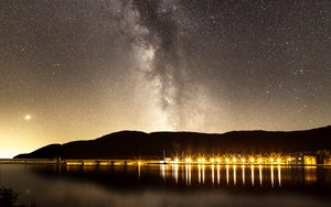 Preview wallpaper nebula, starry sky, stars, pier, lights, night