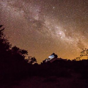 Preview wallpaper nebula, stones, bushes, stars, starry sky