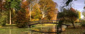 Preview wallpaper netherlands, bridge, river, autumn, trees, leaves