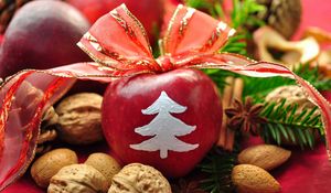 Preview wallpaper new year, holiday, table, apples, ribbon, bow, decoration, walnuts, pine needles, pine cones, cinnamon