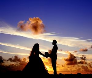 Preview wallpaper newlyweds, silhouettes, couple, love, sunset, clouds
