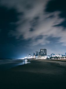 Preview wallpaper night city, beach, night, sky, overcast, clouds