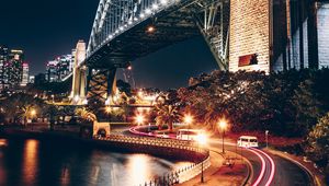 Preview wallpaper night city, bridge, river, movement, turn