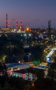 Preview wallpaper night city, buildings, factory, road, trees