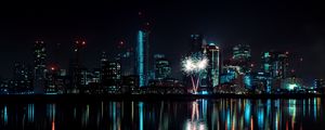 Preview wallpaper night city, buildings, fireworks, water, reflection