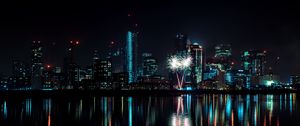 Preview wallpaper night city, buildings, fireworks, water, reflection