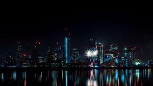 Preview wallpaper night city, buildings, fireworks, water, reflection