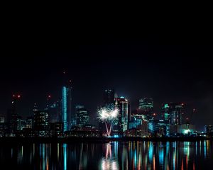 Preview wallpaper night city, buildings, fireworks, water, reflection