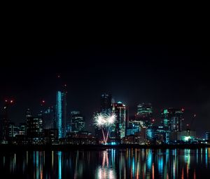 Preview wallpaper night city, buildings, fireworks, water, reflection