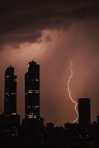 Preview wallpaper night city, buildings, lightning, sky